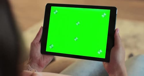 Close Up of Woman Holding a Digital Tablet with Green Screen Internet Online Chroma Key Screen