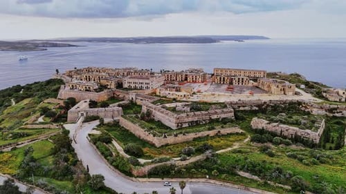 Aerial view of historic fortifications and coastal landscape in Malta