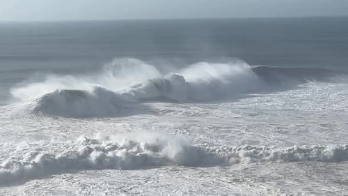 Waves with foam in the air.