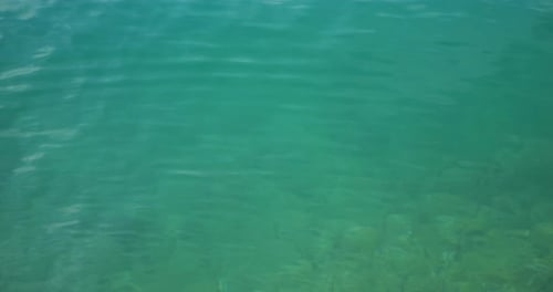 Quiet waters of the Adriatic Sea with clear water and rocky bottom.