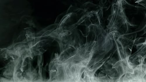 Billowing White Smoke on Black Background