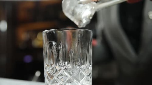 the bartender prepares a cocktail at the bar
