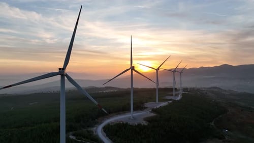 Aerial View Of Wind Power Plant At Sunset