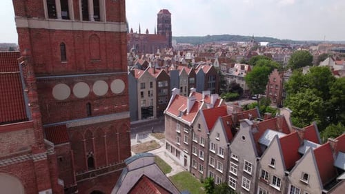 Drone Flight Across the Old Town Tiled Roofs in the Center of Gdansk Poland