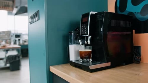 Making coffee into cup coming out from an automatic coffee maker machine Beverage drink breakfast