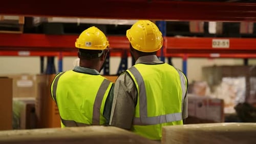 Warehouse Workers Driving Forklift Truck Operating Cardboard Boxes