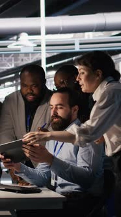 Vertical Video Data Center System Administrators Performing Maintenance on Supercomputers