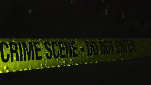 Crime Scene Tape in the Rain at Night