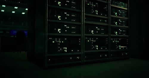 Data Center with Illuminated Servers in Dark Environment at Night