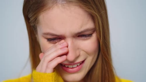 Sad Woman Crying with Tears Streaming Down Face
