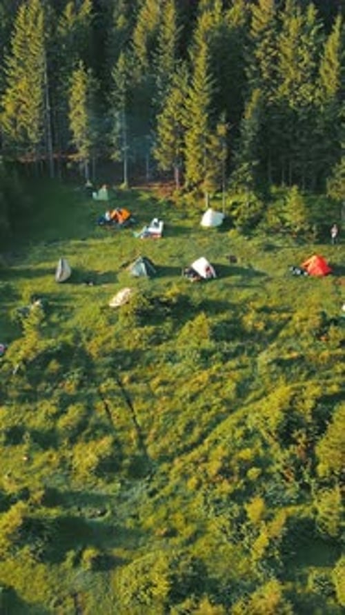 Flight Over a Tent Camping Group of Tourists in the Mountains at Sunrise Potato Town of a Group of