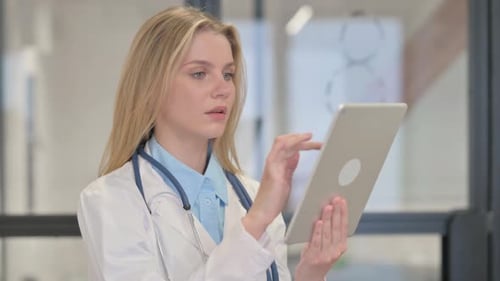 Female Doctor Using Tablet for Medical Work