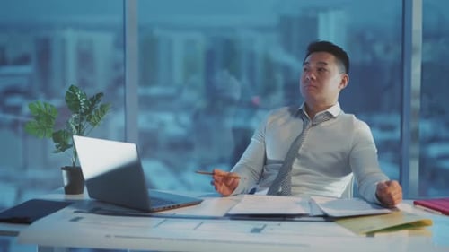Manager Reviews Plans Indoors Calmly Business Leader Pauses Reflecting During Intensive Planning