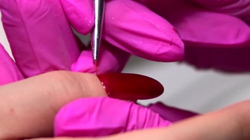 Close Up Applying Red Gel Nail Polish