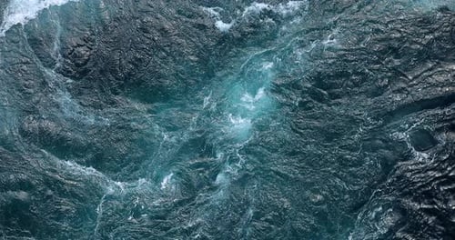 Blue waves of water of the river and the sea meet each other during high tide and low tide.