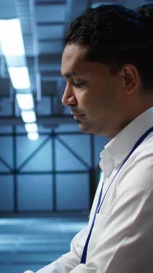 Adult Man Working in a Data Center
