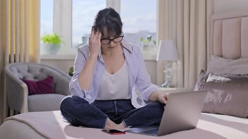 Woman Working From Home with Headache
