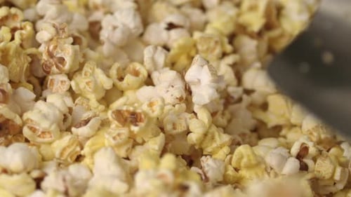 Fresh Hot Popcorn Mixing in Popcorn Machine. Popcorn Background. Close Up Of