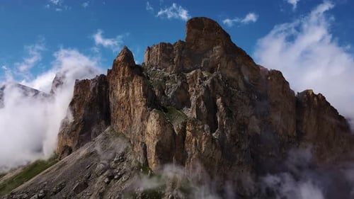 Mountain Ranges are Shrouded in White Air Clouds on a Sunny Day