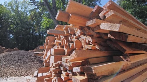 Freshly Cut Lumber Piled High in the Countryside