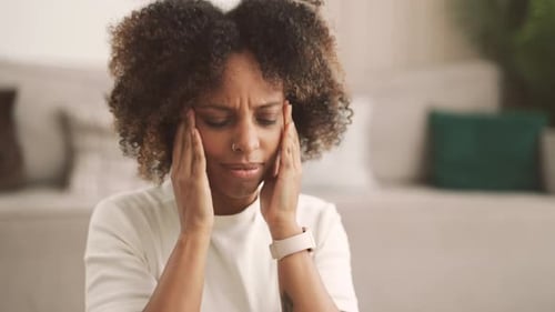 Black Woman Feeling Hard Ache in Head Portrait of Adult Lady at Home Interior Beautiful African