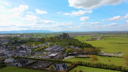 Aerial view of the Rock of Cashel, capturing ancient stone walls, round towers, and cathedral ruins