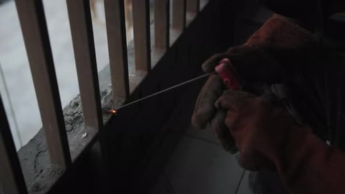 Person Welding Metal with Bright Sparks