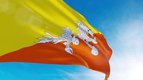 Bhutan National Flag Waving in Wind Against Bright Sky