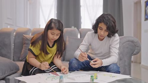 Indian kids doing artwork and paintings