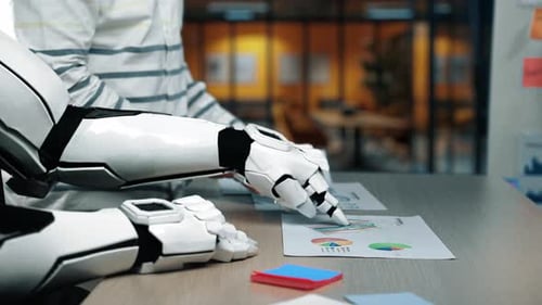 Man Works with Robot on Charts at Office