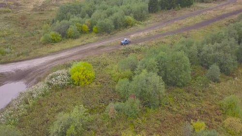 Off Road Vehicle Driving on Muddy Track in Competition