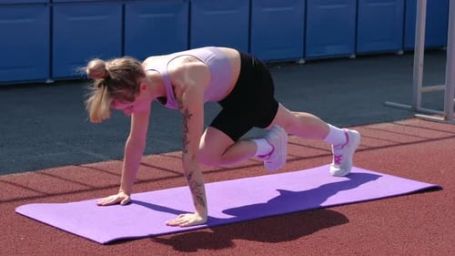 Woman Exercising Outdoors Doing Mountain Climber Workout
