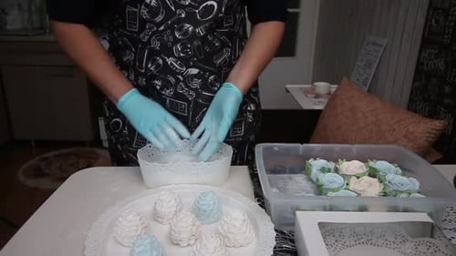 A Woman Sprinkles Homemade Marshmallows Sugar. Spruce Cones From Marshmallows.