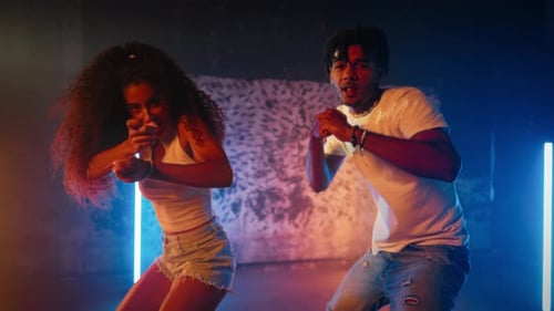 Dancehall Performers Moving Synchronously in Dance Studio Black Man and Woman Joyful Young People