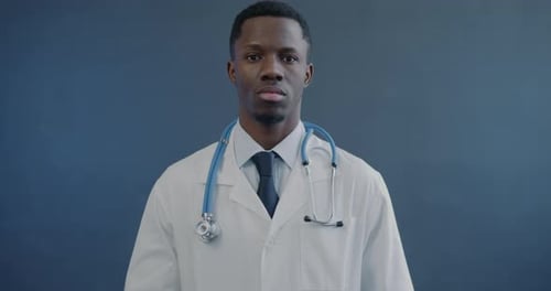 Young Adult Doctor Wearing Stethoscope and Lab Coat