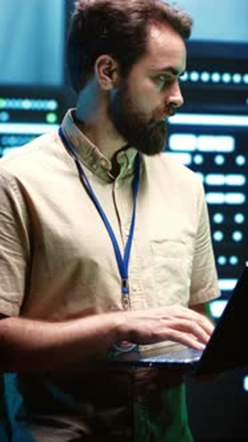 Vertical Video Technician Checking Server Hub