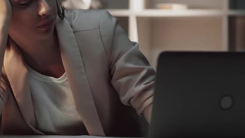 Tired Woman Working Late at the Office