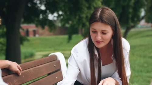 Engaging in a Game of Checkers in the Park Provides a Delightful and Thrilling Summertime Date