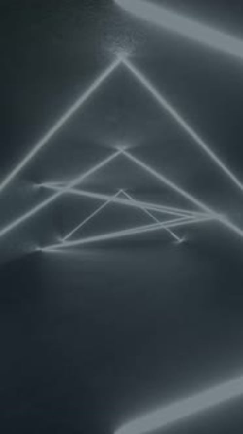 3D neon triangle glows on concrete floor