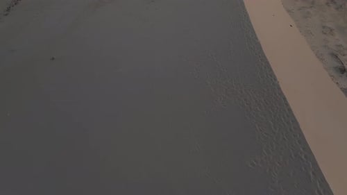 Aerial View of Desert Dunes at Sunrise
