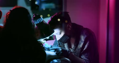 Milan/Italy-01.02.2019:Slow motion of professional master of the art of tattooing doing a tattoo t