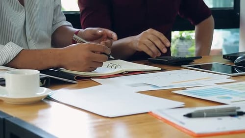 Businessmen financial inspector and secretary calculating balance.