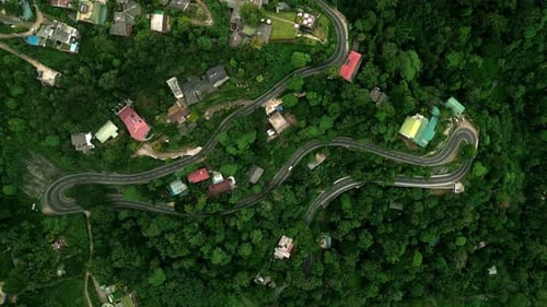 Winding Mountain Road Snakes Through Rich Sri Lankan Highlands Vehicles Navigate Tight Turns Amid