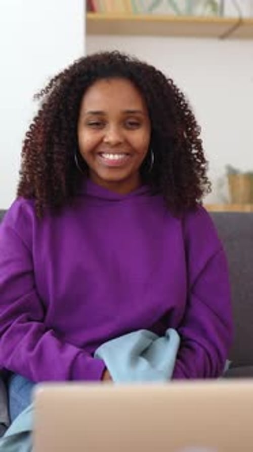 Happy Woman Talking and Laughing on Laptop