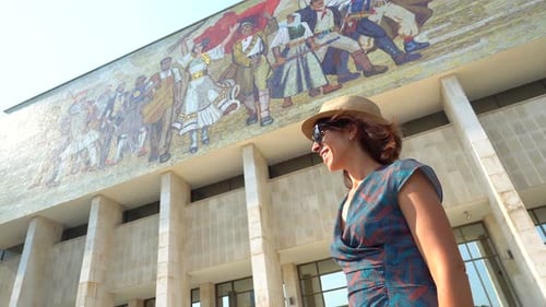 A female tourist visiting the National Historical Museum at Skanderbeg Square in Tirana. Albania
