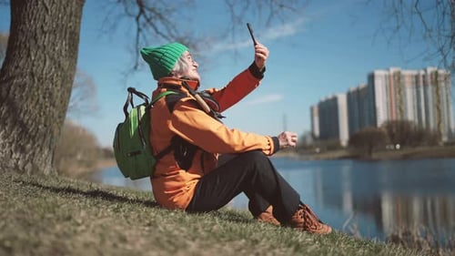Good Sunny Weather in Park Elderly Lady Taking Selfie By Mobile Phone Outdoors Happy Retirement and