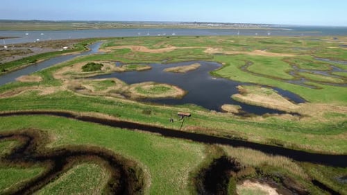 Drone Ascending On Tollesbury Marina In River Blackwater Estuary Salt Marshes, Essex UK. Aerial