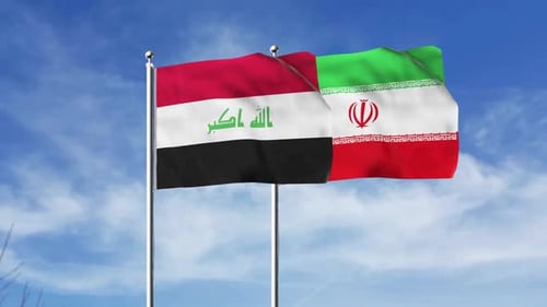 Iraq and Iran National Flags Waving Against Blue Sky