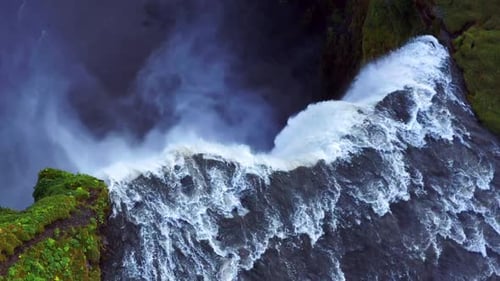 Top View Of The Famous Skogafoss Waterfall In Iceland - aerial drone shot