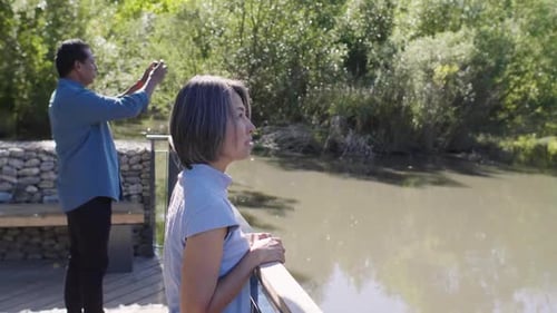 Mature Couple Photographing Sunny Park Pond 4549 Years